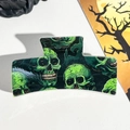Detail of black Halloween hair claw clip featuring vibrant green skull pattern print - 8.5cm Printed Solid Square Green Skull (005-01)