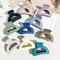 Flat lay of 10-piece matte Morandi hair claws set on a decorative tray - Matte Hollow Semicircle