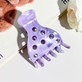Detailed close-up of large purple marble pattern hair claw clip with hollow dot design - Light Purple