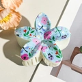 Close-up of a floral five-petal flower hair claw clip with colorful UV printed patterns - Blue Floral (8cm)