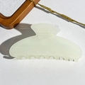 Detail of a minimalist ivory semicircular hair claw clip for thick hair styling - 10.5CM Square Head / UV Transparent Creamy White