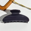 Close-up of a large glossy semicircular shark hair claw clip on a white leather surface - 10.5CM Square Head / UV Solid Deep Brown
