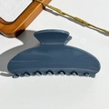 Detailed view of dark blue semi-circle hair claw clip on white leather background - 10.5CM Square Head / UV Solid Blue Gray