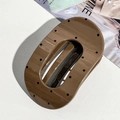 Polished brown oval hair claw clip with black polka dots on fashion magazine background - Coffee Oval Polka Dot (9.5cm)