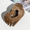 Detail of heart-shaped dark brown hair claw clip with white polka dots and glossy finish - Cream Heart Polka Dot (9.5cm)