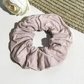 Detailed close-up of large pale pink hair scrunchie with subtle vertical ribbed texture - Light Purple