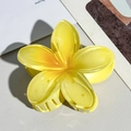Close-up of a translucent yellow plumeria hair claw clip with detailed resin petals - 8cm Creamy Yellow Plumeria Claw