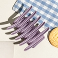 Detail of matte purple cross hair claw clip on blue checkered cloth background - Matte Light Purple