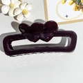 Detail of a deep purple rectangular hair claw with double heart design on white petals - Transparent Purple Red