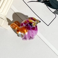Vue détaillée de deux pinces à cheveux en forme d'oiseau avec un motif mosaïque coloré - PVC / Poussin Rose Et Orange