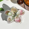 Close-up of a marble texture floral hair claw clip on a white leather surface - Nude Pink (M-02)