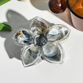 Macro detail of frangipani hair claw with marble texture and black glitter center - Coffee Black (M-08)