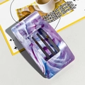 Detail of a rectangular marble acetate hair claw clip with purple and blue textures - Blue Purple