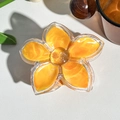 Macro detail of frangipani flower hair claw clip with orange marble pattern and gold glitter - Orange (M-13 Orange)