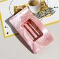 Close-up of pink and white marble texture on a rectangular hair claw clip for thick hair - Pink