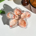 Macro detail of a floral marble pattern hair claw with gold glitter and transparent edges - Vibrant Orange (M-15)