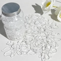 Gomas de pelo transparentes en un tarro de almacenamiento con tapón de rosca plateado - Transparente