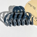 Detail view of the strong gold metal spring on the dark grey-blue large hair claw clip - Navy Blue
