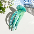 Detail of blue marble marble textured acetate hair claw clip with jellyfish shape design - Emerald Green
