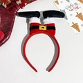 Close-up of Santa Claus legs headband with red velvet fabric and glitter boots for Christmas - Santa Claus Legs