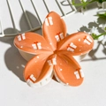 Vibrant orange plumeria hair claw with white gift box patterns and glossy finish - Orange Gift Box Print (141-1)