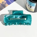 Detailed close-up of dark green marble pattern hair claw clip with acetate texture - PC / Peacock Blue
