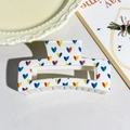 White rectangular claw clip featuring colorful heart patterns and a hollow design - Colorful Heart Pattern Style (117-6)
