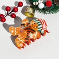 Detail of cute gingerbread man hair claw clip with festive scarf and hat on Christmas decor - Plastic / Christmas Acrylic Snowman Red Green Scarf