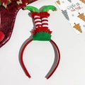 Detail of Christmas headband with elf legs design, striped fabric and golden bells - Christmas Socks with Bells