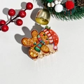 Macro view of gingerbread man Christmas hair claw clip with glossy finish and festive details - Plastic / Christmas Acrylic Happy Gingerbread Man
