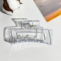 Detail view of transparent rectangular hair claw clip with golden metal spring - Clear White