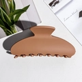 Close-up of a matte caramel brown semi-circular hair claw clip on a stylish white background - Square Shape / PS / Matte Orange