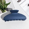 Detail view of a matte navy blue claw clip with sturdy teeth and a smooth curved design - Square Shape / PS / Matte Navy Blue