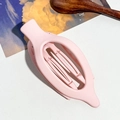 Detail of a matte pink oversized hair claw clip on a stylish textured background - 11.5cm Oval Clip / Matte Pink