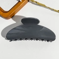 Close-up of sleek grey glossy half-moon hair claw clip with rounded teeth for secure grip - Square Shape / PS / Glossy Smoke Grey