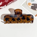 Macro detail of amber tortoise shell hair claw clip with elegant acetate texture - 11cm Rectangular Coffee Leopard Glossy