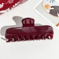 Detailed view of large dark red hair claw clip with glossy finish on textured white background - 11cm Rectangular Wine Red Glossy