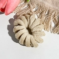 Macro shot of a beige plush spiral hair tie on white leather background with pink tulips - Spiral Structure (20251108b) / Solid Light Coffee