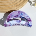 Macro detail of high-end acetate hair claw clip with purple and blue marble pattern - Blue Purple