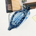 Blue leopard print hair claw clip made of translucent resin with a hollow oval design - Blue Leopard Print Oval Clip