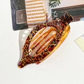 Curved leopard print hair claw clip in amber translucent acrylic for women - Amber Leopard Print Oval Clip