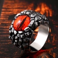 Macro shot of gothic stainless steel ring with red dragon eye gemstone and scale texture - US Size 7 / Red