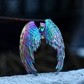 Macro detail of rainbow plated angel wing pendants with fine feather texture engraving - Colorful Electroplated Style / Colorful