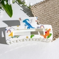 White dinosaur cartoon print hair claw clip with colorful UV design and GO logo - Sports Dinosaur Pattern (139-4)