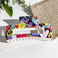 Graffiti style large hair claw clip with LOVE print and heart pattern on beige frame - LOVE Graffiti Style (149-2) / ABS