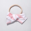 Detailansicht eines Baby-Nylon-Stirnbands mit rosa Schleife und Blattmuster - Rosa und Weiß Blattader