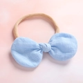 Detail of baby headband with a light blue linen bow and high-elastic nylon band - Sky Blue