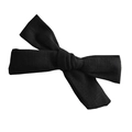 Detailed view of the woven fabric texture on a minimalist black cotton bow hair clip - Black