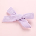 Close-up of light purple bow hair clip showing high-quality cotton linen fabric texture - Purple