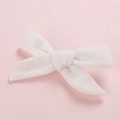 Detail shot of white linen cotton bow hair clip with textured fabric for girls - White